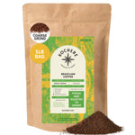 A 1lb bag of Kochere Coffee Company’s Brazilian Santos Medium Roast—smooth and elegant with cocoa notes—in a tan bag with green and yellow label. Coarse ground, single origin, low acid, bold flavor. Ground coffee pictured in front.