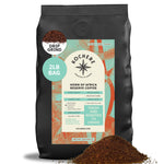 A 2-pound bag of Kochere Coffee Horn of Africa Reserve Signature Espresso Blend by Kochere Coffee Company, medium-dark roast, sits with specialty espresso grounds spilled in front.