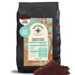 A 2lb bag of Kochere Coffee Horn of Africa Reserve Signature Espresso Blend, a medium-dark roast by Kochere Coffee Company, in fine grind, comes in black and teal packaging with a coffee scoop icon and loose ground coffee shown on the front.