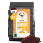 A 5lb bag of Kochere Coffee Colombian Medellin Single Origin Medium Roast by Kochere Coffee Company, featuring dried orange and berry notes. Packaging displays Fairtrade and fresh-to-order roasting, with ground coffee shown in front.
