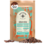 A 12oz brown bag of Kochere Coffee Company’s Horn of Africa Reserve Signature Espresso Blend (Medium-Dark Roast, whole bean), with specialty coffee beans scattered in front of the package.