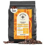A 5-pound bag of Kochere Coffee Costa Rican Alajuela Medium Light Roast by Kochere Coffee Company, featuring sweet apple and raisin notes, with an orange and yellow roast-detail label and scattered whole beans.