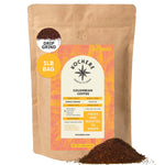 A 1-pound bag of Kochere Coffee Company’s Colombian Medellin Single Origin Medium Roast, with dried orange and berry notes in drip grind, shows product details on the label and a small pile of ground coffee in front. [1lb][drip grind]