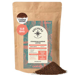 A 1lb bag of Kochere Coffee Company’s Ethiopian Harrar Natural Medium Roast, featuring fruity, berry, and dark chocolate notes with a coarse grind; the colorful label is shown with a small pile of grounds in front.[1LB][coarse grind]