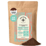 A 16oz brown bag of Kochere Coffee Ethiopian Sidamo Natural Medium-Light Roast by Kochere Coffee Company, featuring milk chocolate and fruity notes. The blue and white label highlights its single origin, coarse grind, and premium quality.[1LB][coarse grind]