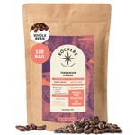 A 16oz bag of Kochere Coffee Tanzanian Mbeya AB Medium-Light Roast whole beans from Kochere Coffee Company, featuring fresh single origin coffee with pear, floral, and jasmine notes for a vibrant experience.