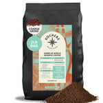 A 2-pound bag of Kochere Coffee Company’s Horn of Africa Reserve Signature Espresso Blend, medium-dark roast, sits next to a small pile of ground coffee.[2lb][coarse grind]