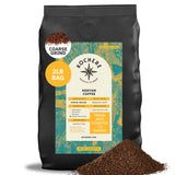 A 2-pound bag of Kochere Coffee Company's Kenyan Nyeri Embu AB Medium-Light Roast sits upright, labeled coarse grind, with coffee grounds spilled in front. The packaging features product details and a green-yellow design.