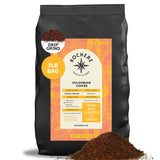 A 2lb bag of Kochere Coffee Company’s Colombian Medellin Single Origin Medium Roast, drip grind, with dried orange and berry notes, is shown with coffee grounds spilled in front.[2lb][drip grind]