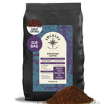 A 2-pound bag of Kochere Coffee Company's Honduran Marcala Organic Medium Roast, featuring caramel, spice, and brown sugar notes, with coffee grounds scattered in front.[2LB][drip grind]