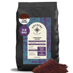 A 2-pound bag of Kochere Coffee Honduran Marcala Organic Medium Roast, featuring caramel, spice, and brown sugar notes from Kochere Coffee Company, with fair trade ground coffee displayed in the foreground.