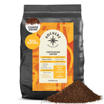 A 5lb bag of Kochere Coffee Costa Rican Alajuela Medium Roast from Kochere Coffee Company, featuring sweet apple and raisin notes, sits with some coarse coffee grounds spilled in front. Labeled single origin, medium light roast.[5LB][coarse grind]
