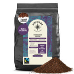 A 5lb bag of Kochere Coffee Honduran Marcala Organic Medium Roast, by Kochere Coffee Company, with caramel, spice, and brown sugar notes. The bag displays origin, roast info, a Fairtrade logo, and spilled coffee grounds in front.