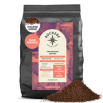 A 5lb bag of Kochere Coffee Tanzanian Mbeya AB Medium-Light Roast by Kochere Coffee Company, featuring pear, floral, and jasmine notes with coffee grounds spilled in front.