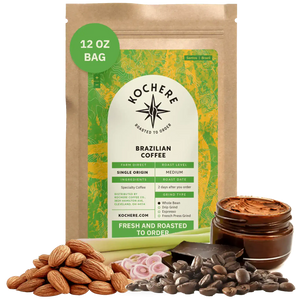Bag of Kochere Single Origin Brazilian medium roast coffee, displayed with raw almonds, fresh lemongrass, and dark chocolate to represent its balanced, aromatic flavor profile. [12 oz][Whole Bean]