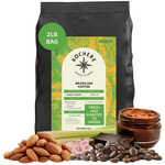Bag of Kochere Single Origin Brazilian medium roast coffee, displayed with raw almonds, fresh lemongrass, and dark chocolate to represent its balanced, aromatic flavor profile. [2LB][Whole Bean]