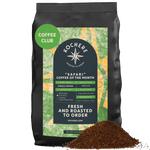 A bag of Kochere Coffee Company’s Kochere Safari "Coffee of the Month" Club—Fresh Roasted Single Origin Subscription sits beside fresh grounds, ready to elevate your next coffee subscription experience.[2LB][drip grind]