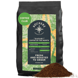 A bag of Kochere Coffee Company’s Kochere Safari "Coffee of the Month" Club—Fresh Roasted Single Origin Subscription sits beside fresh grounds, ready to elevate your next coffee subscription experience.