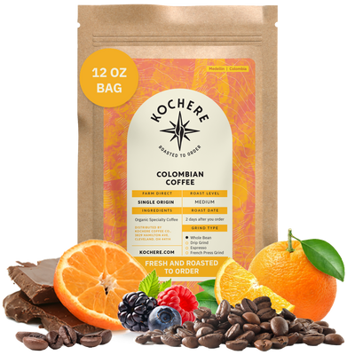 Bag of Kochere Single Origin Colombian medium roast coffee, displayed with rich chocolate, fresh oranges, and sweet mixed berries to represent its vibrant flavor profile. [12 oz][Whole Bean]