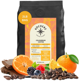 Bag of Kochere Single Origin Colombian medium roast coffee, displayed with rich chocolate, fresh oranges, and sweet mixed berries to represent its vibrant flavor profile. [2LB][Whole Bean]