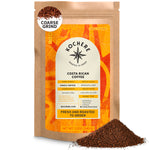 A 12oz bag of Kochere Coffee Company’s Costa Rican Alajuela Medium Roast, featuring sweet apple and raisin notes, with a coarse grind. The label highlights fresh roasting and specialty grade coffee. Ground coffee is piled in front.[12 oz][coarse grind]