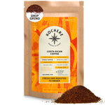 A 12oz bag of Kochere Coffee Costa Rican Alajuela Medium Light Roast by Kochere Coffee Company—specialty, single origin, drip grind—with sweet apple and raisin notes, and ground coffee displayed in front of the package.