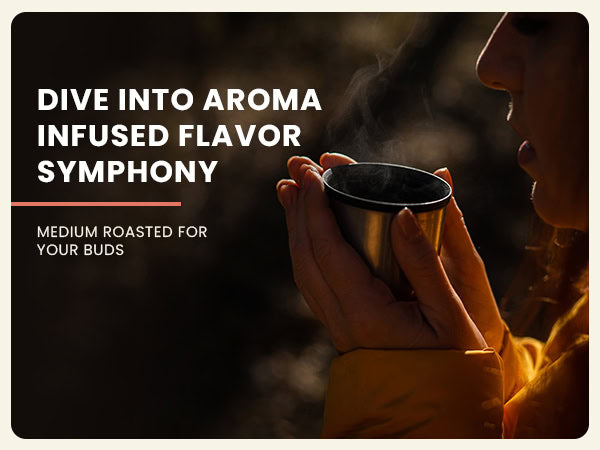 A person holds a steaming cup close to their face, with white text reading "Dive into aroma infused flavor symphony. Medium light roasted for your buds.