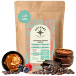 Bag of Kochere Single Origin Ethiopian Sidamo medium-light roast coffee, displayed with rich caramel, fresh berries, and dark chocolate to represent its decadent flavor profile. [1LB][Whole Bean]