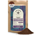 A 12oz bag of Kochere Coffee Company's Honduran Marcala Organic Medium Roast—notes of caramel, spice, and brown sugar—coarse ground, with a purple and blue label showing origin, roast info, freshness, and coffee displayed in front.