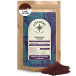 A 12 oz bag of Kochere Coffee Company’s Honduran Marcala Organic Medium Roast, with caramel, spice, and brown sugar notes, and medium-ground coffee displayed beside the packaging.