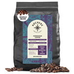 A 5lb bag of Kochere Coffee Company Honduran Marcala Organic Medium Roast, whole beans, single origin with caramel, spice, and brown sugar notes—freshly roasted to order—with fair trade beans scattered in front.