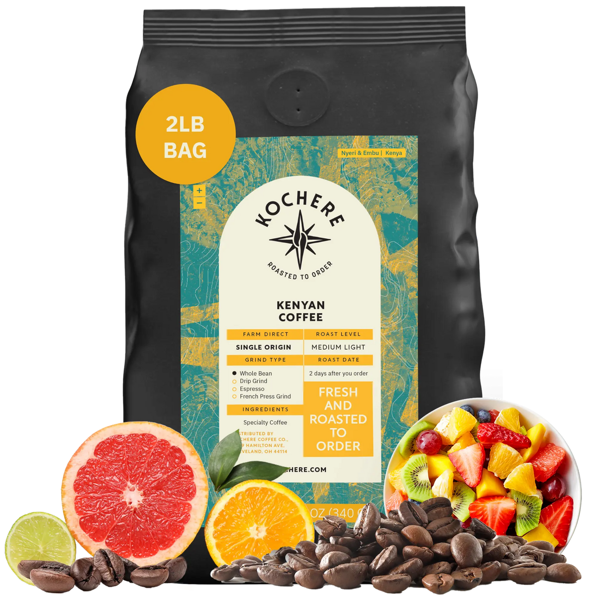 A 2lb bag of Kochere Coffee Kenyan Nyeri Embu AB by Kochere Coffee Company sits among fresh fruit, citrus slices, and coffee beans—highlighting the fruity, balanced, and bright notes of this medium-light roast.