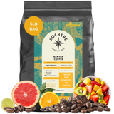 A 5-pound bag of Kochere Coffee Company’s Kenyan Nyeri Embu AB Medium-Light Roast, surrounded by coffee beans and assorted fruit, highlights its fruity, balanced flavor with bright citrus notes.