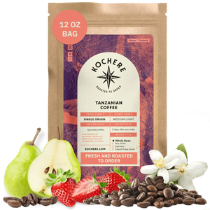 Bag of Kochere Single Origin Tanzanian medium-light roast coffee, displayed with fresh pears, sweet strawberries, and white blossoms to represent its crisp and aromatic flavor profile. [12 oz][Whole Bean]