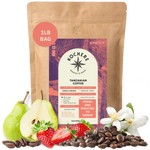 Bag of Kochere Single Origin Tanzanian medium-light roast coffee, displayed with fresh pears, sweet strawberries, and white blossoms to represent its crisp and aromatic flavor profile. [1LB][Whole Bean]