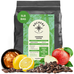 Bag of Kochere Single Origin Ugandan medium roast coffee, displayed with rich caramel, fresh lemons, and crisp red apples to represent its sweet and vibrant flavor profile. [5LB][Whole Bean]
