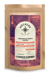 A bag of Tanzanian Mbeya Coffee - Simple Origin - Medium Light Roast by Kochere Coffee Company with a label on it.