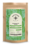 A brown coffee bag from Kochere Coffee Company labeled "Ugandan Sipi Falls Single Origin, Organic Medium Roast - Raisin, Fig, Brown Sugar Notes," with origin and roast details on a green and white sustainably sourced label.
